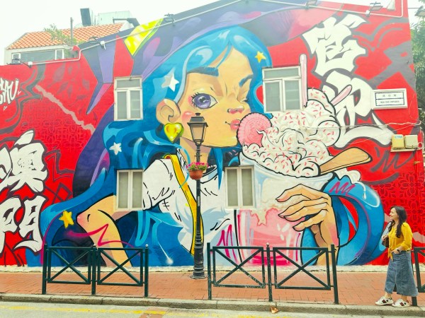 Large street art mural of an anime-style girl on a wall in Taipa Village, Macau China