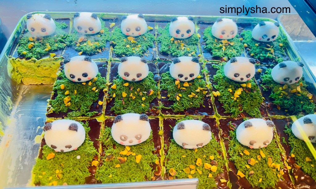 Panda dessert with some green sprinkles on top