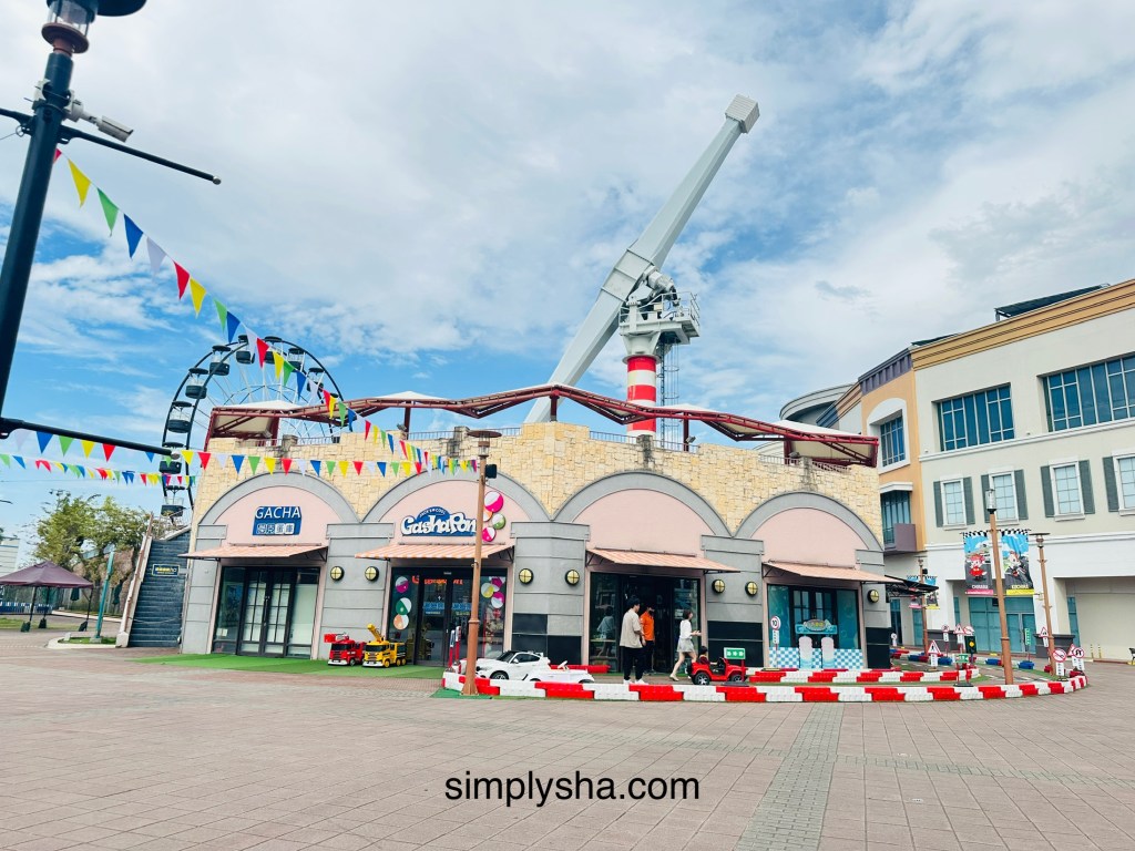 Theme park with a yellow and pink building