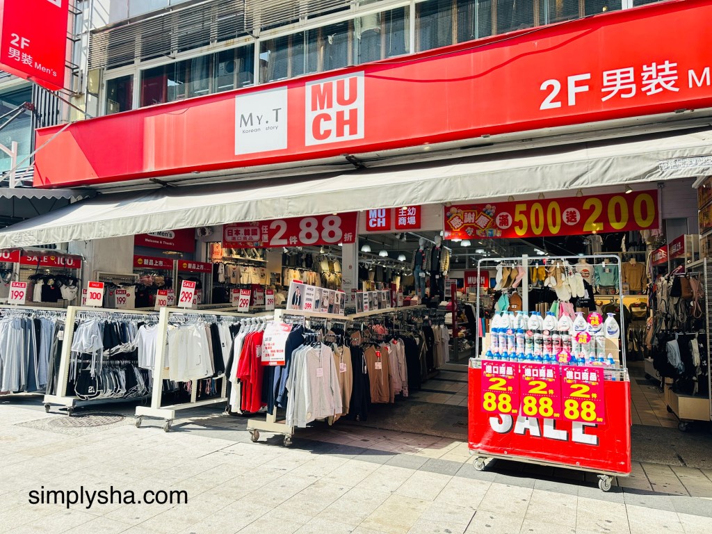 Red store showing multiple clothes on display