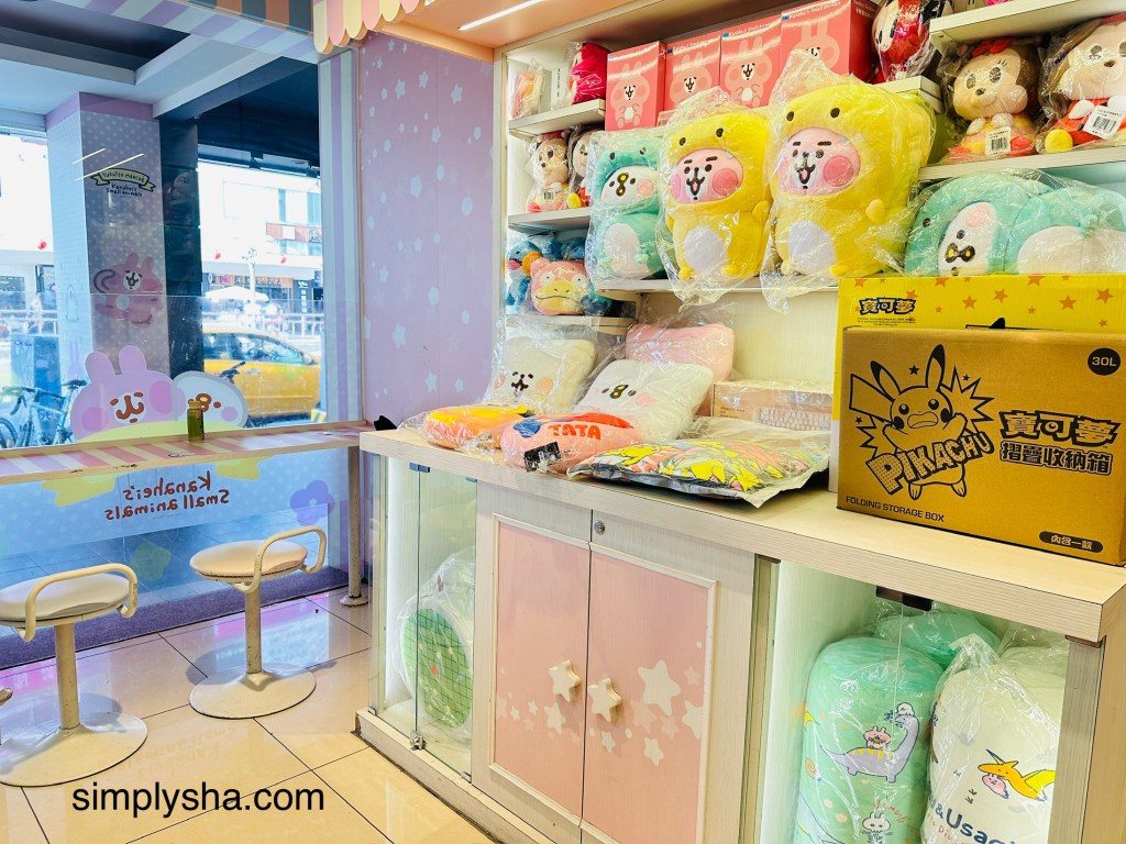 Adorable stuff toy on a pink and white shelf