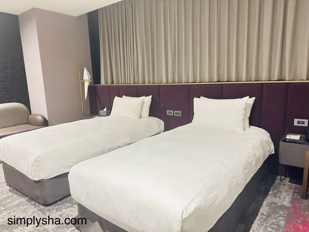 Twin beds in a hotel room