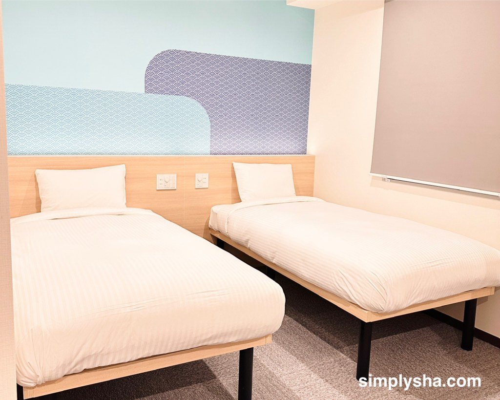 Two single beds in a triple room at Hop Inn Tokyo Asakusa