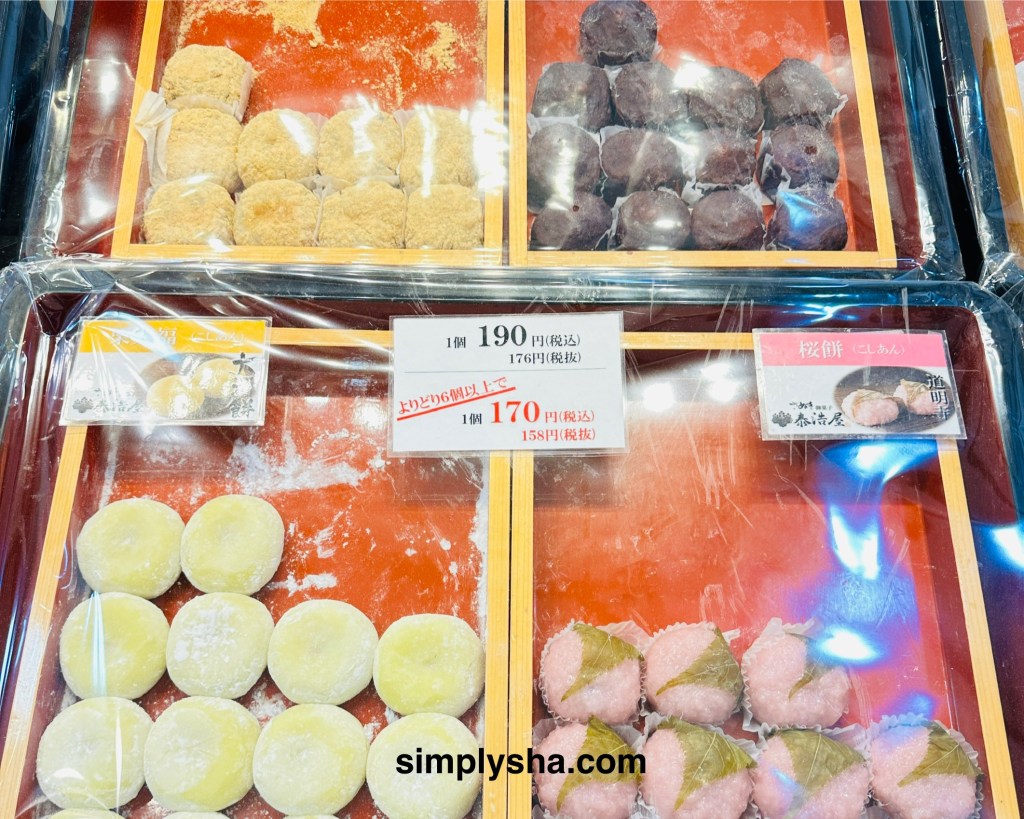 Traditional Japanese sweets including mochi and sakura rice cakes on display in Asakusa