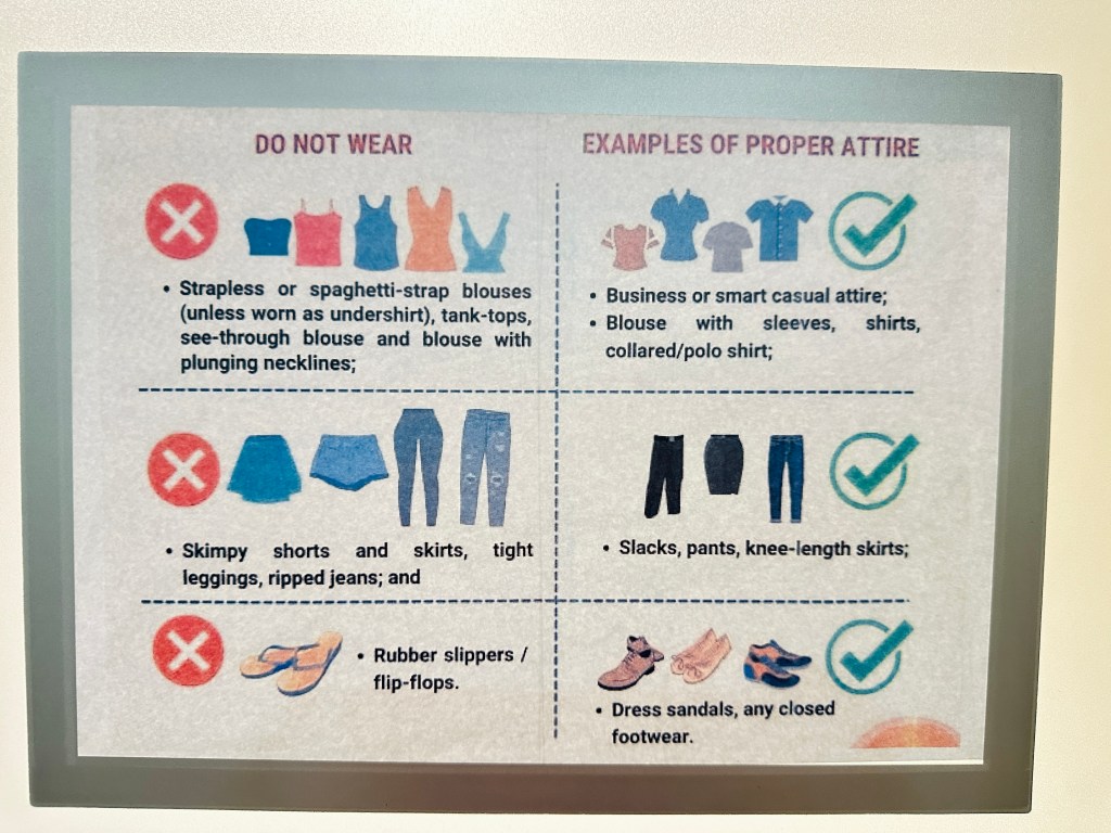 Poster from the China Visa Application Service Center showing dress code rules: Do not wear sleeveless tops, skimpy shorts, ripped jeans, or slippers. Proper attire includes business or smart casual clothing, blouses with sleeves, slacks, knee-length skirts, and closed shoes.
