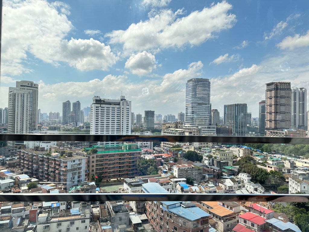 City view of Guangzhou skyline and buildings as seen from the hotel window.