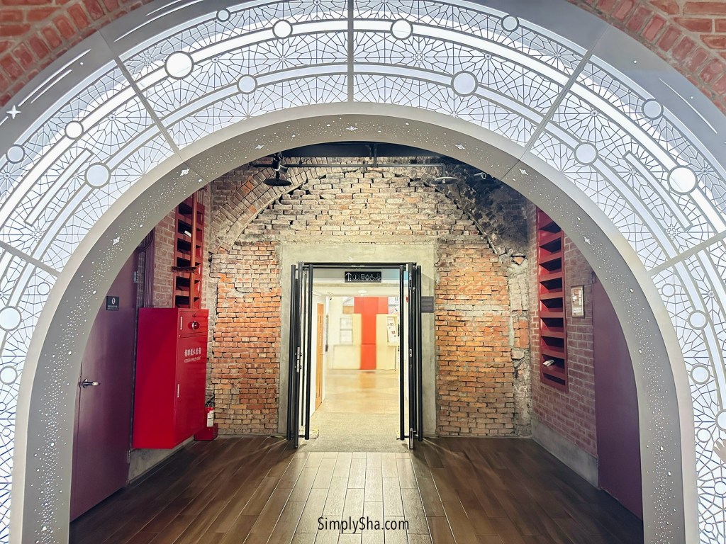 Arched brick hallway inside the Red House cultural building in Ximending