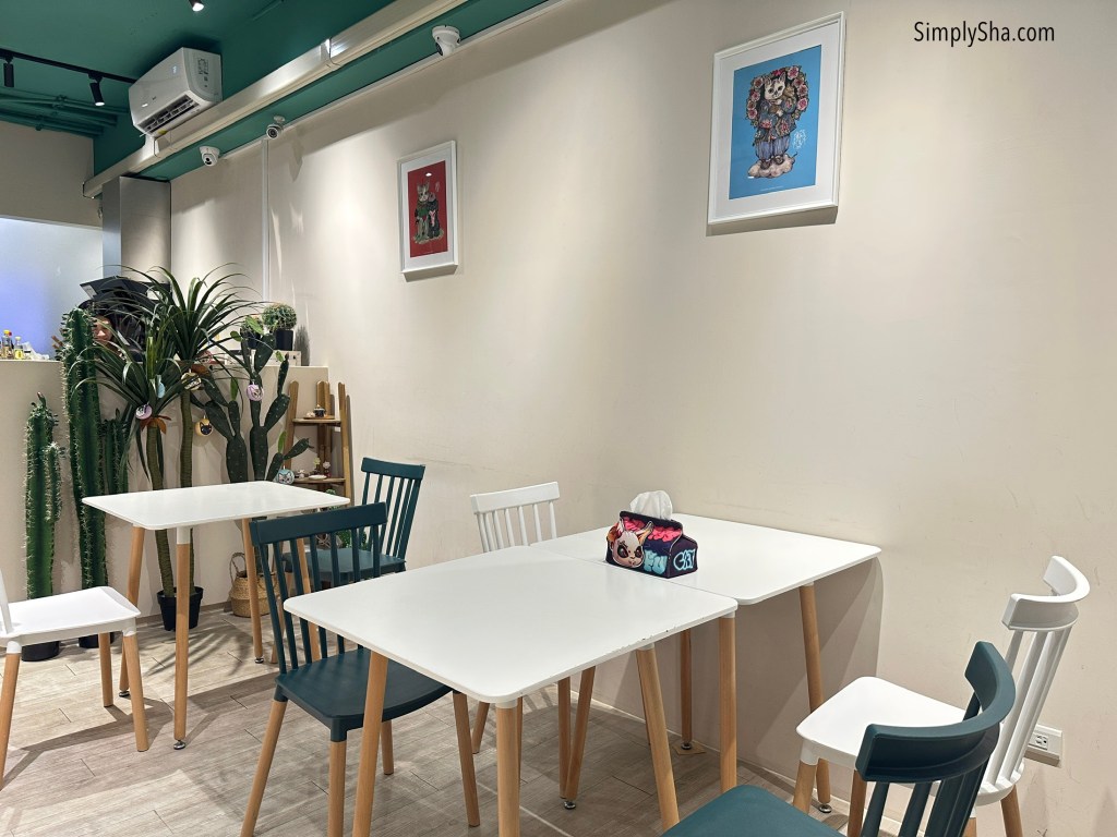 Seating area and tables inside Fu Fu Cat Cafe in Ximending, Taipei