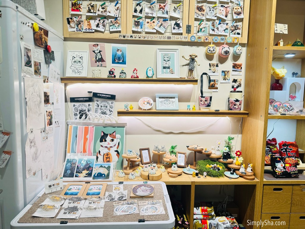 Cat-themed merchandise and souvenirs inside Fu Fu Cat Cafe in Ximending.