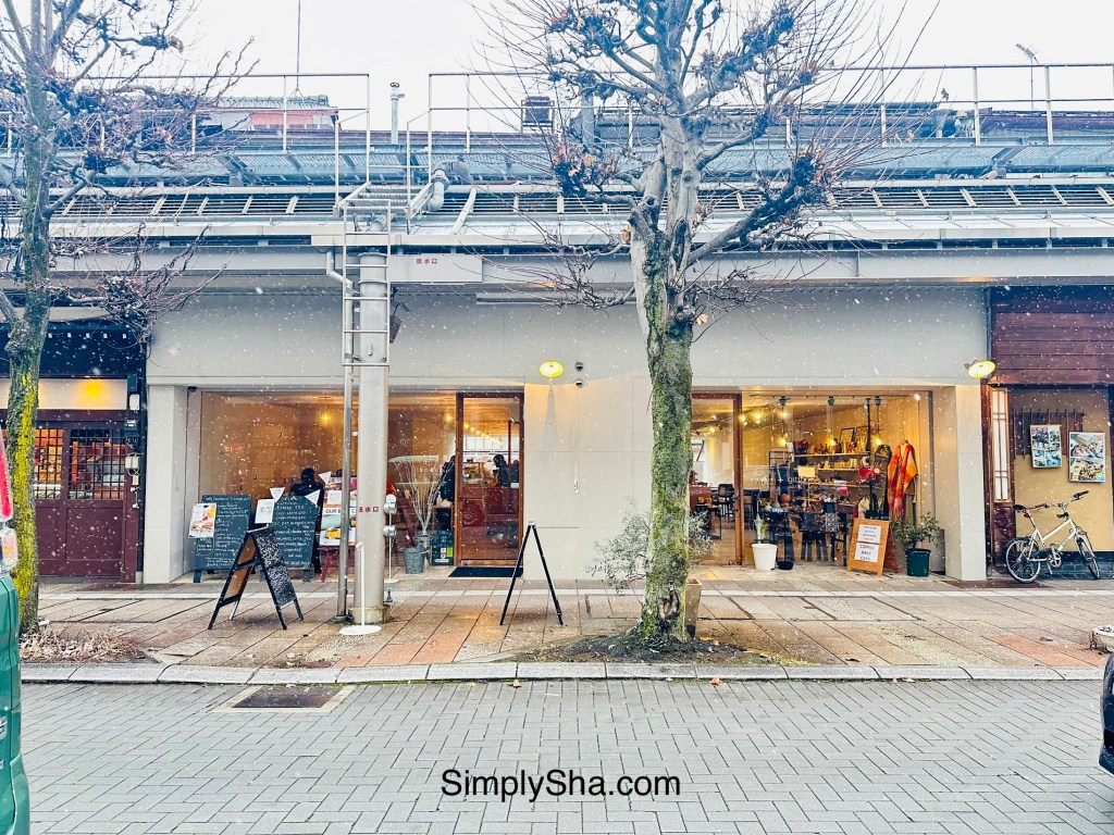 Snowy street with local shops in Takayama old town