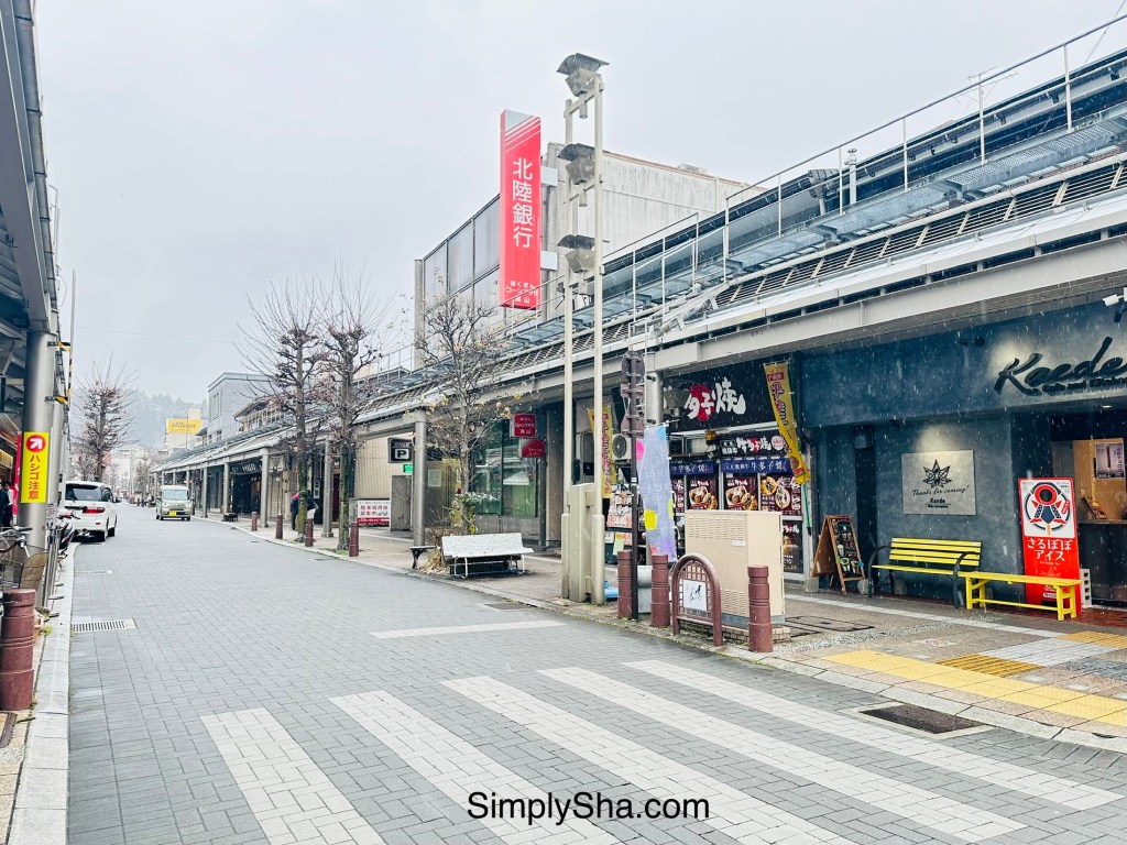 Quiet street lined with local restaurants and stores in Takayama