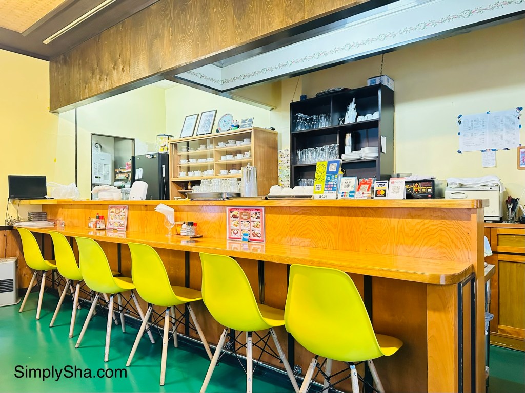 Cozy local cafe interior with counter seating in Takayama