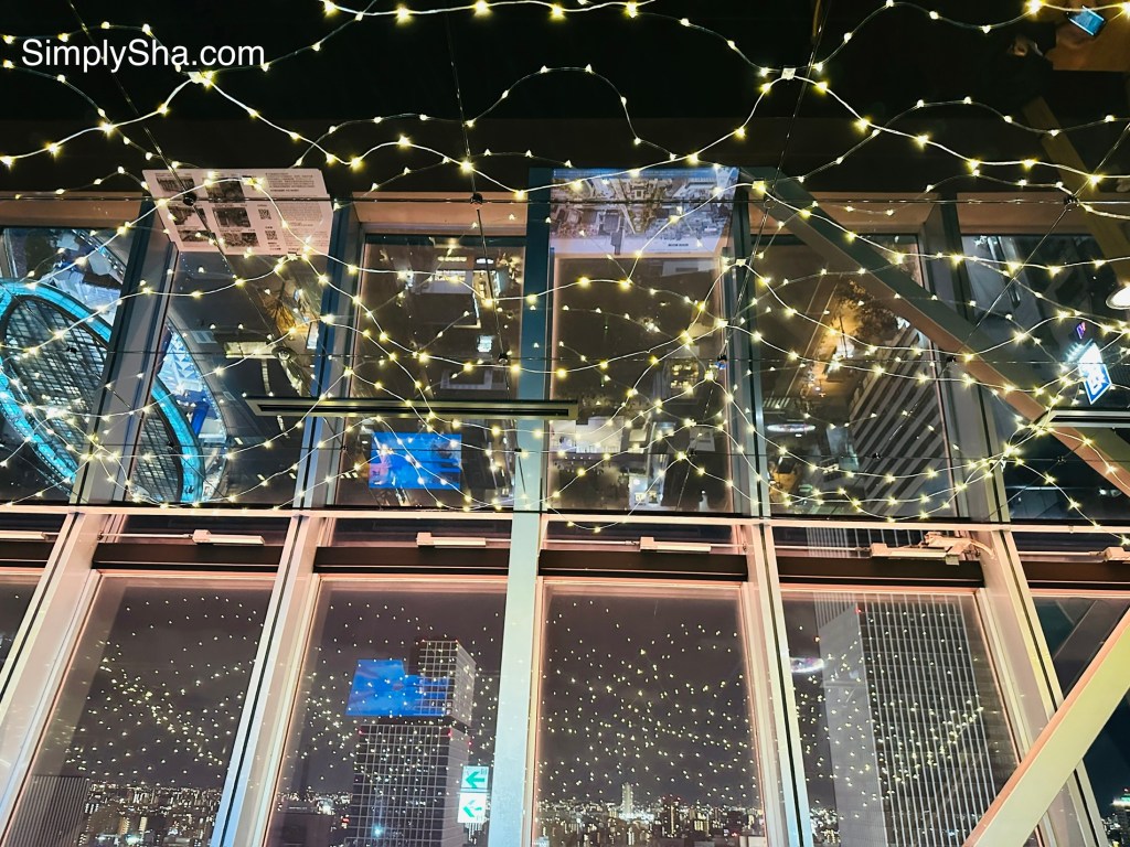 Mirai Tower observation deck with illuminated glass floor at night