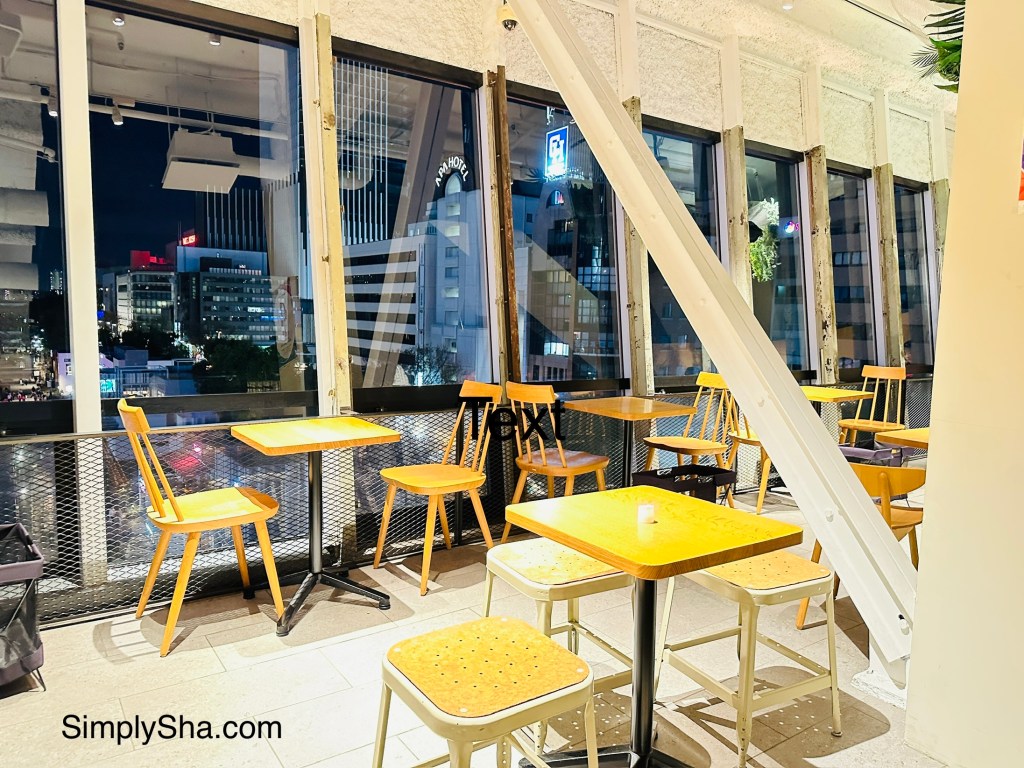 Alison Cafe seating area with city view at Mirai Tower Nagoya
