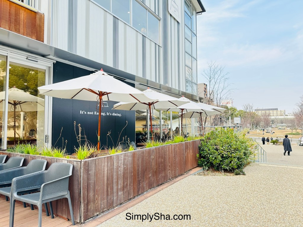 Cafe with outdoor seating and umbrellas at Hisaya Odori Park in Nagoya