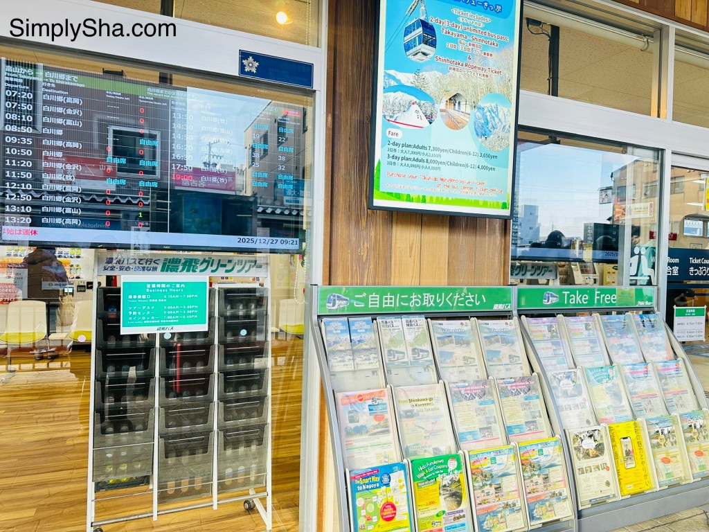 bus schedule board and travel brochures at Nohi Bus Center in Takayama