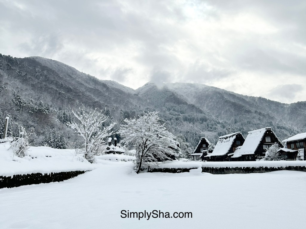 Shirakawa-go winter landscape with traditional houses and snow-covered mountains