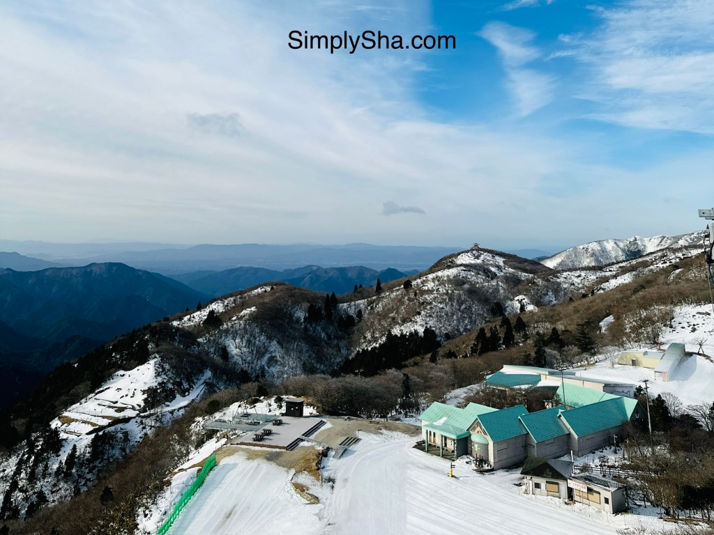 Mt. Gozaisho summit view with snow-covered mountains and ski area in winter