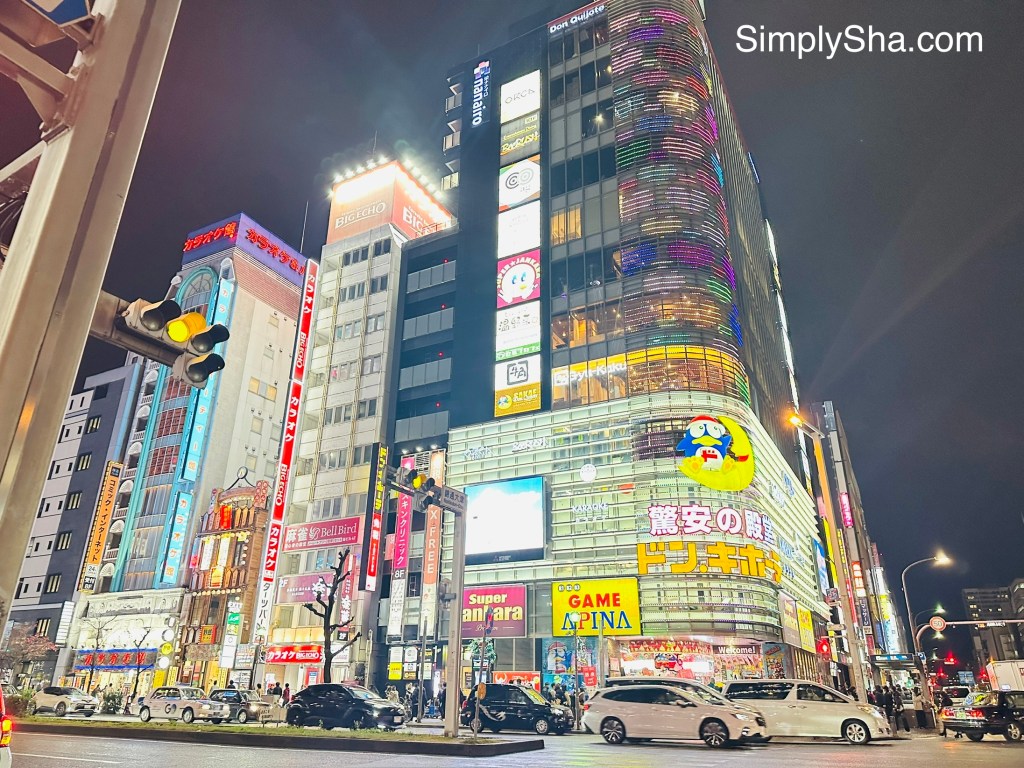 Brightly lit buildings and shops in Sakae District at night in Nagoya, Japan