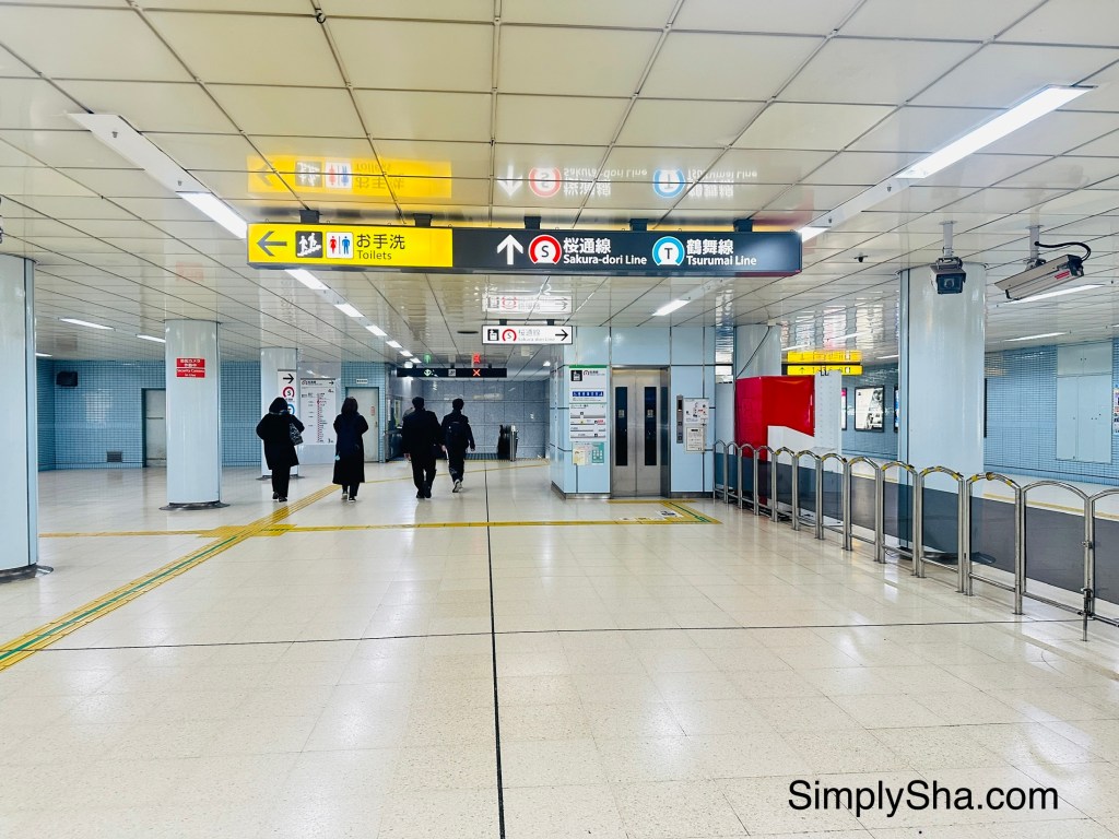 Directional signs inside a Nagoya subway station in Japan