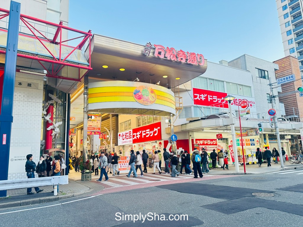 Shoppers walking along Osu Shopping Street in Nagoya, Japan
