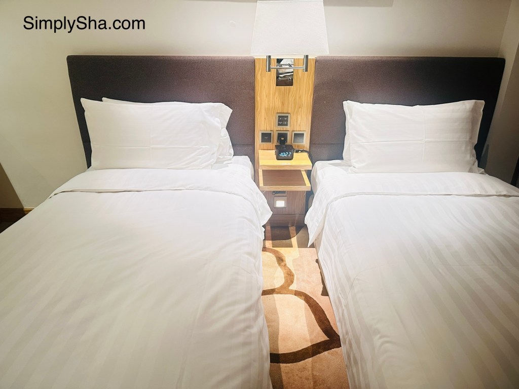 Comfortable twin beds at The Beacon in Mong Kok, Hong Kong