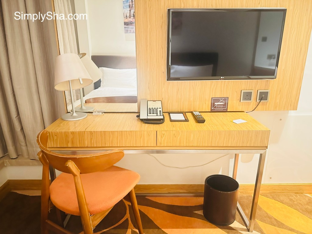 Desk and TV area in a guest room at The Beacon in Mong Kok, Hong Kong