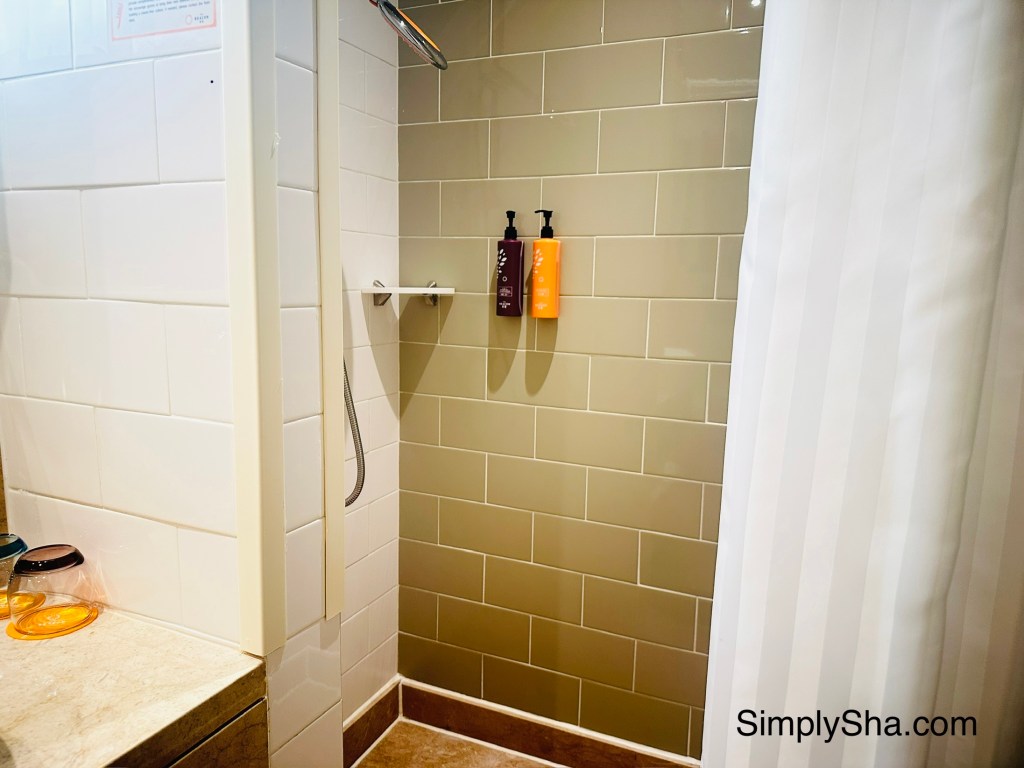 Modern walk-in shower at The Beacon in Mong Kok, Hong Kong