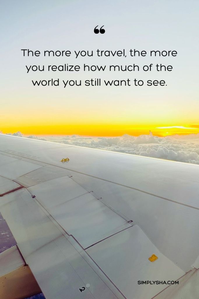 Travel quote about exploring more of the world with a sunrise view from an airplane window.